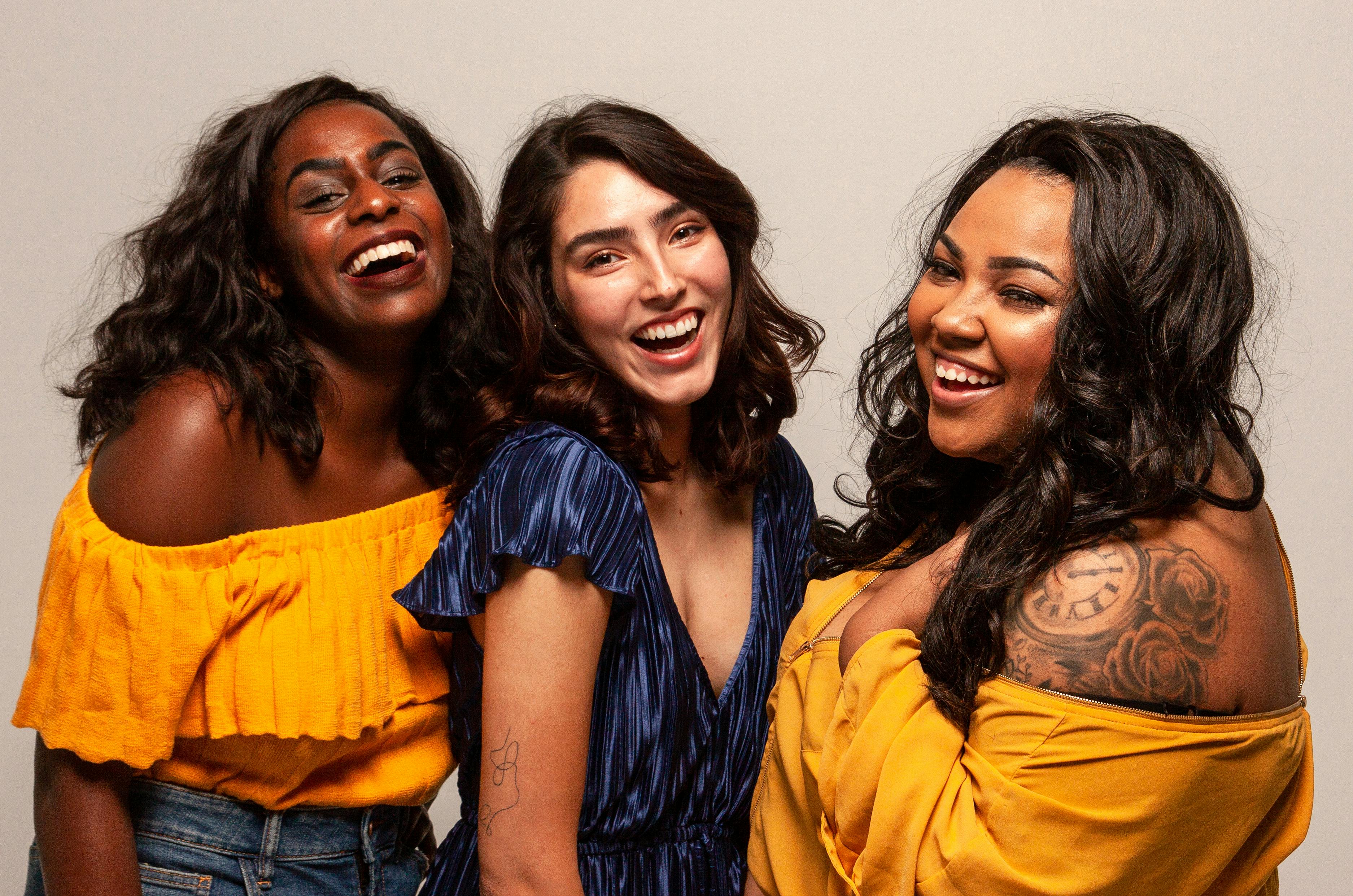 group of laughing women with diverse body shapes