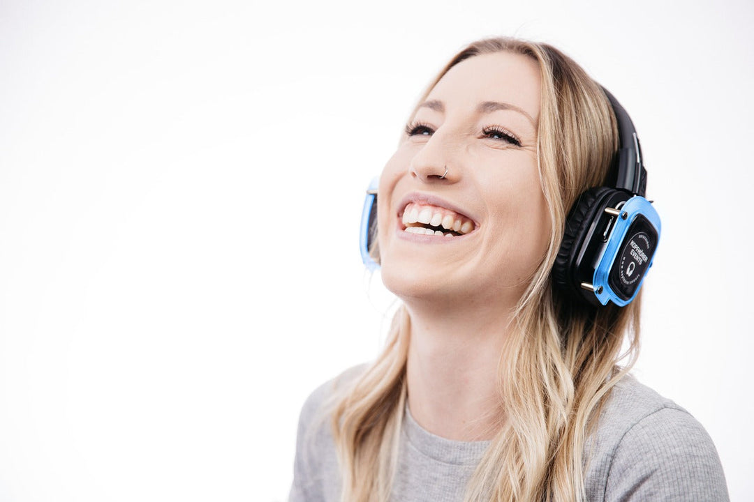 Woman with headphones managing sensory needs — autism in women
